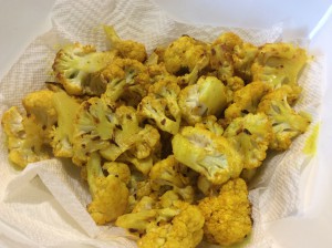 Oven-roasted cauliflower bites, flavored with turmeric, red pepper flakes and sea salt.
