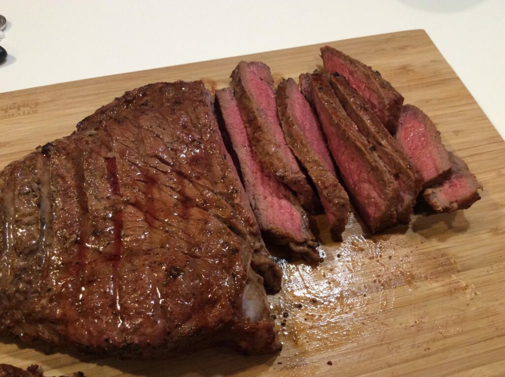 Easy London Broil Recipe - Finished steak on cutting board after slicing.