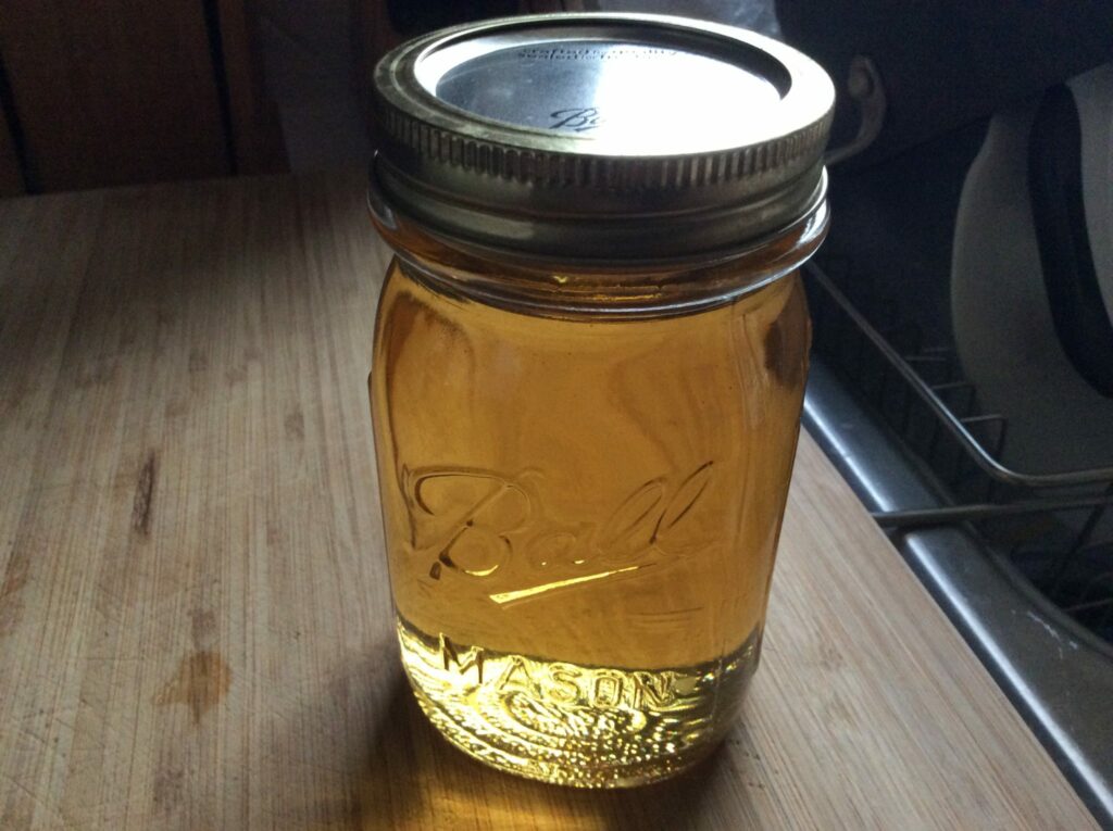 Homemade Golden Syrup in pint jar