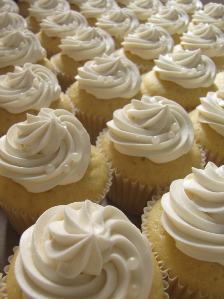 Lemon Buttermilk Cupcakes, iced with sugar pearls.