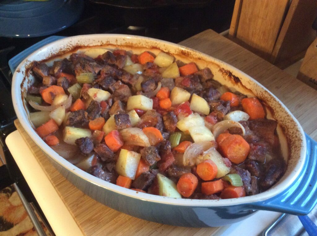 Oven Baked Beef Stew in blue casserole dish.