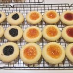 Raspberry Thumbprint Cookies cooling on a tray