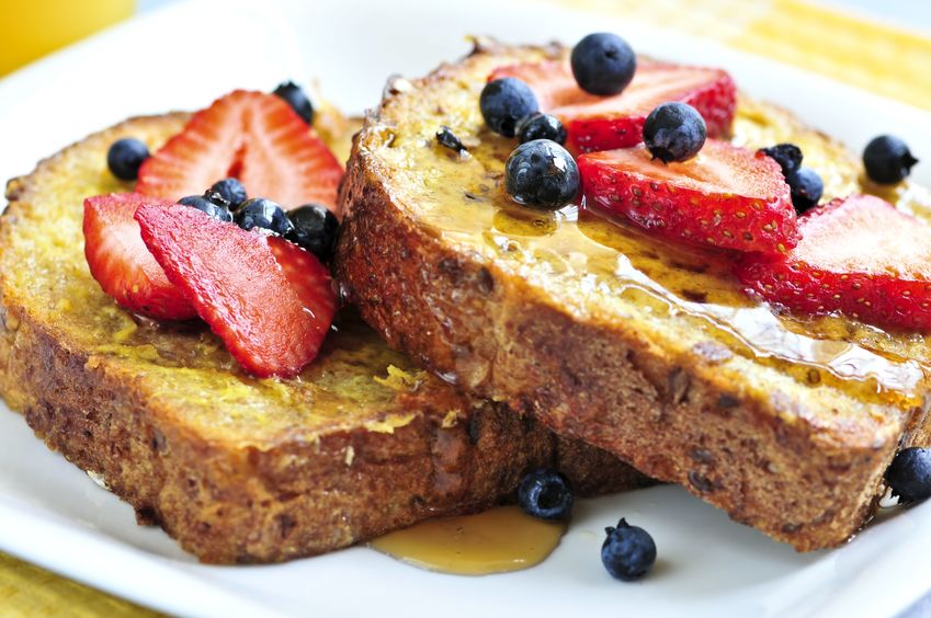 Baked French Toast with syrup and berries