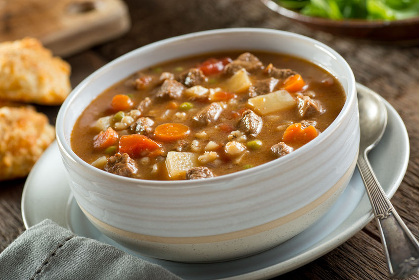 Instant Pot Beef and Barley Soup, served in ceramic bowl.