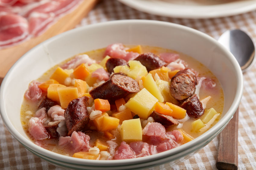 Traditional Dublin Coddle Recipe in ceramic bowl with spoon