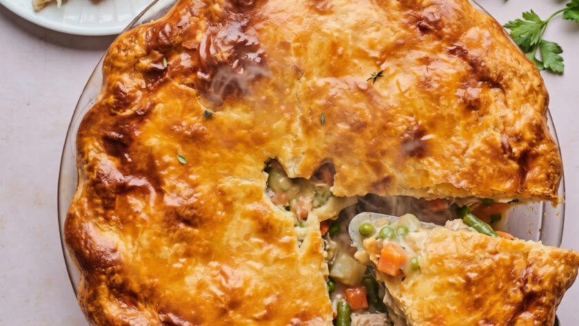 Homemade Chicken Pot Pie served from a glass pie plate.