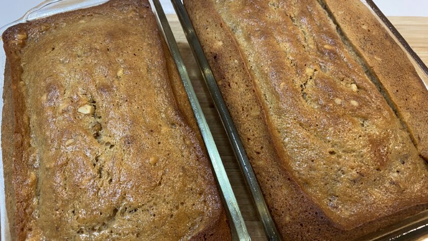 Two loaves of Easy Banana Nut Bread Recipe in glass baking pans