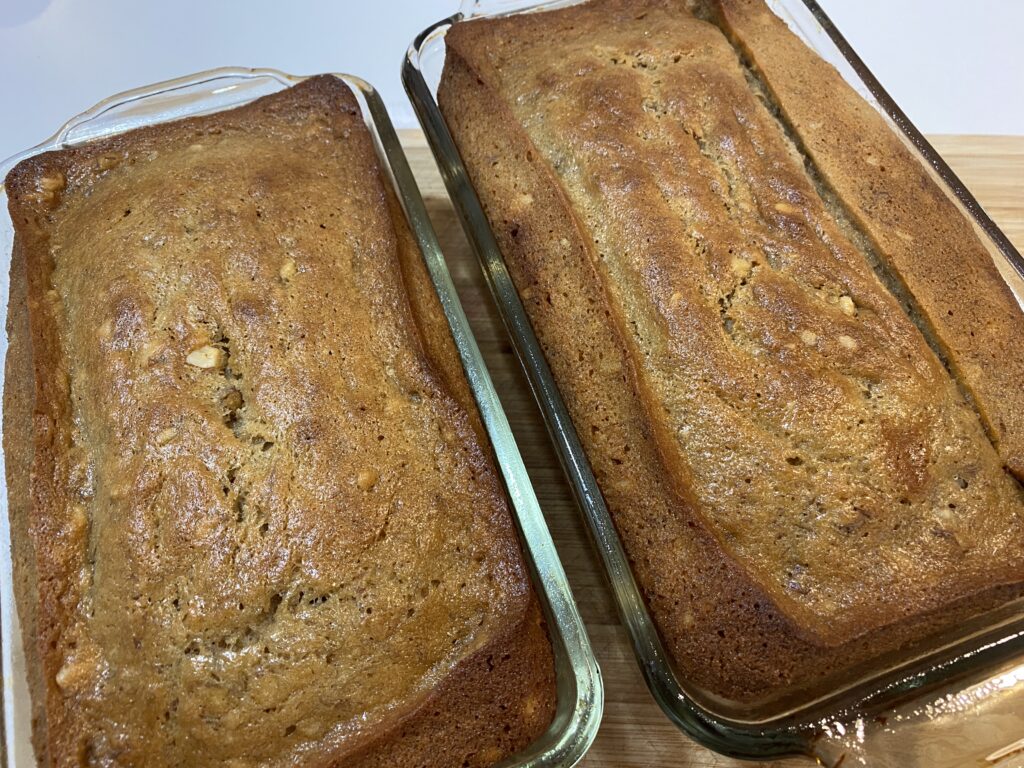 Two loaves of Easy Banana Nut Bread Recipe in glass baking pans