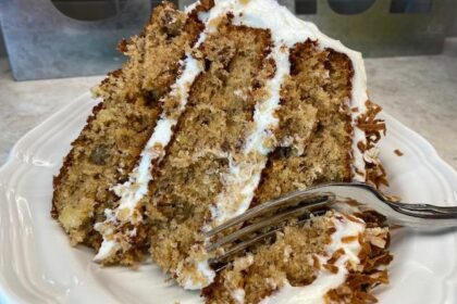 Hummingbird cake on a plate with a fork