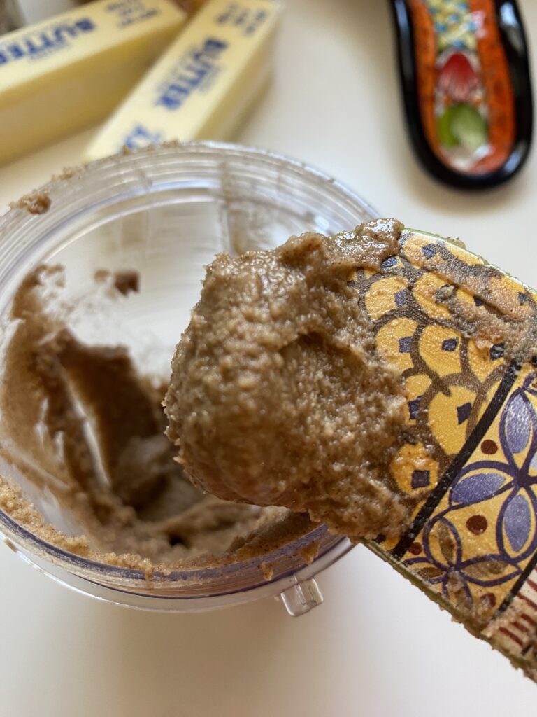 Pecan butter paste on a spatula