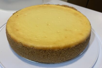 Cheesecake on a cake plate, uncut