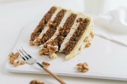 high-altitude carrot cake on a plate with fork