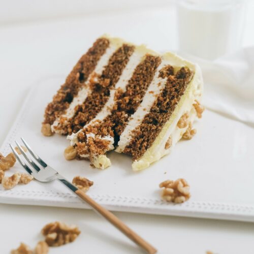 high-altitude carrot cake on a plate with fork