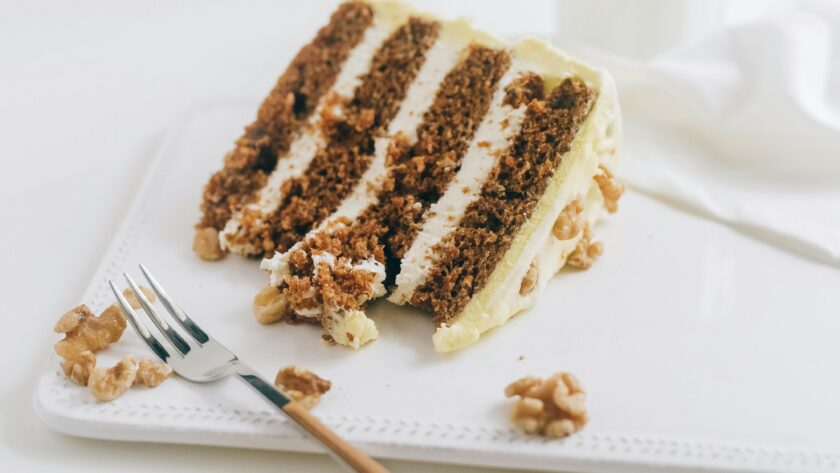 high-altitude carrot cake on a plate with fork
