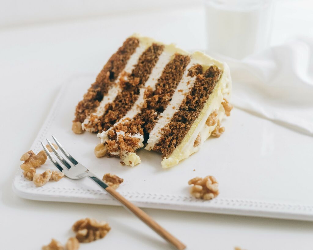 high-altitude carrot cake on a plate with fork
