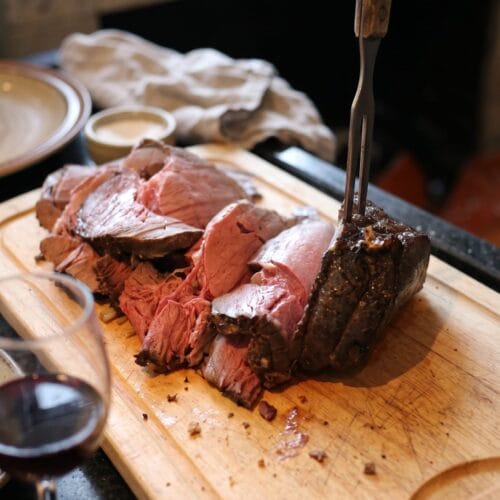 Oven roast beef on a wooden carving block