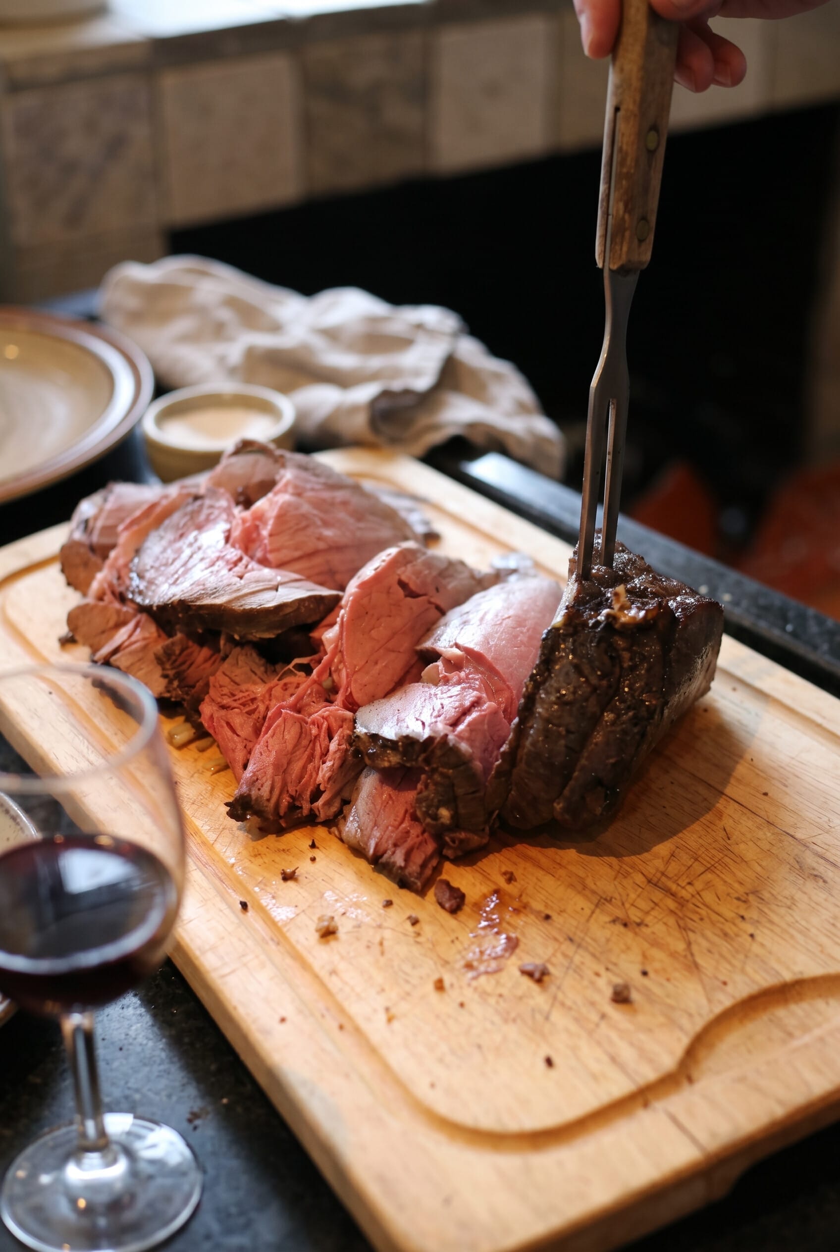 Oven roast beef on a wooden carving board.