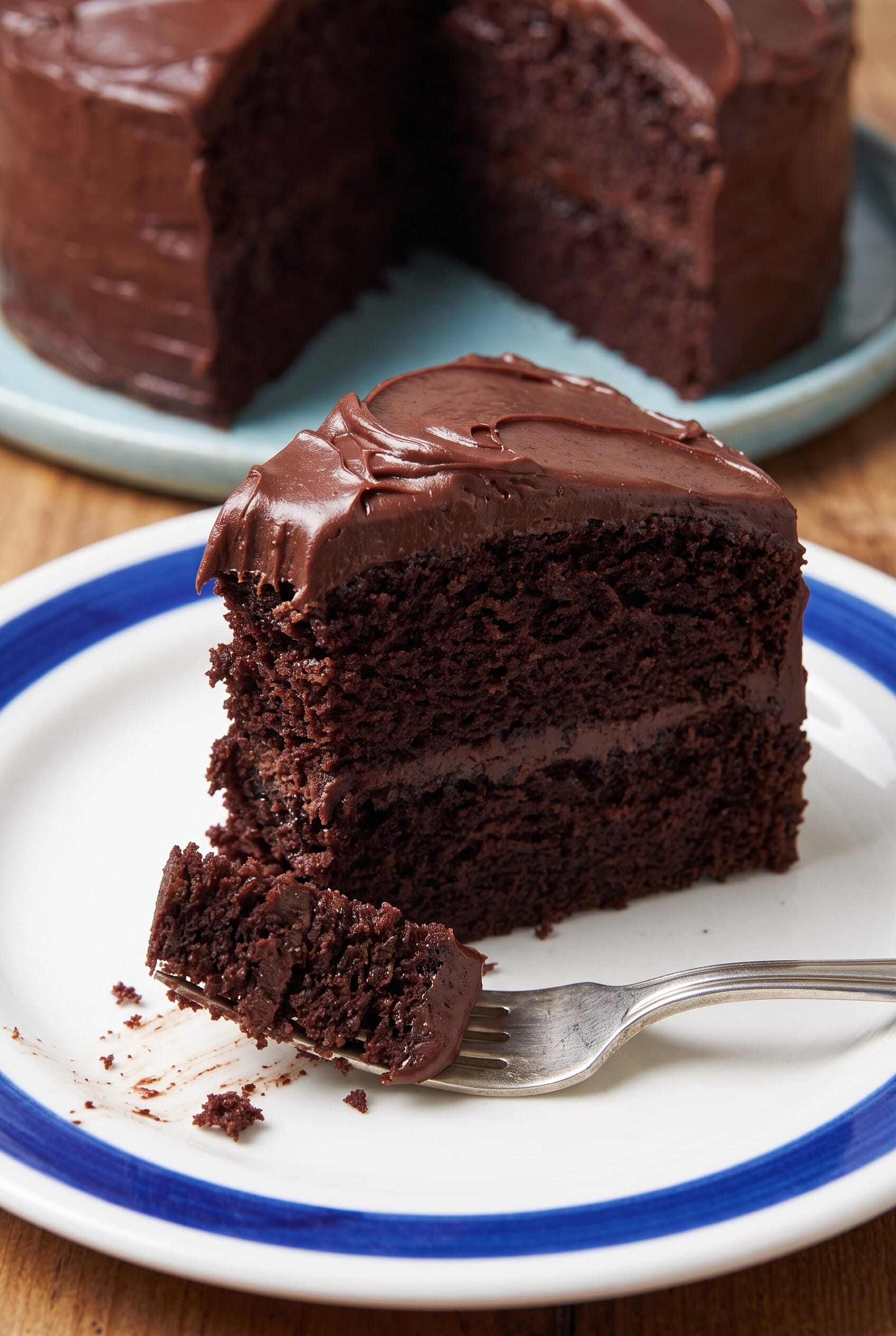A slice of Double Chocolate Layer Cake on a dessert plate