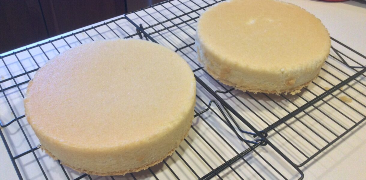 Hot Milk layer cakes cooling on a rack