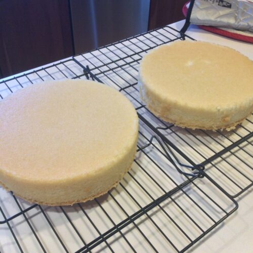 Hot Milk layer cakes cooling on a rack
