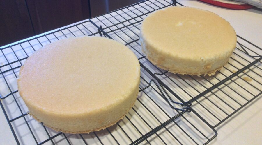 Hot Milk layer cakes cooling on a rack
